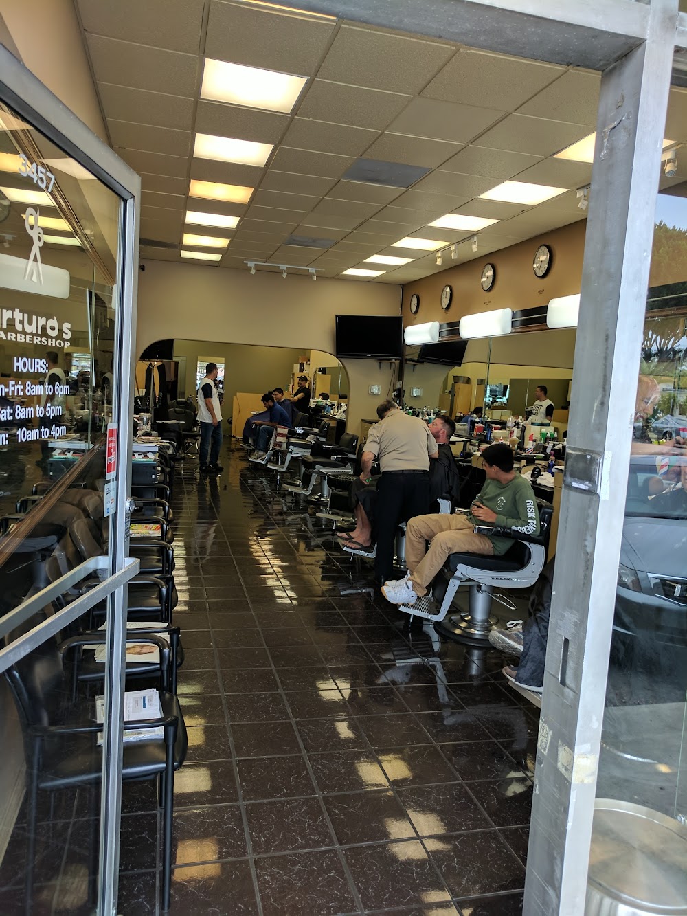 Arturo's Barbershop and Hair Salon interior showcasing our experienced barbers providing quality haircuts in Santa Barbara